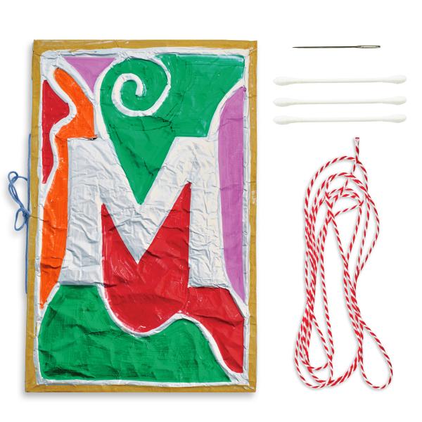 Medieval illuminated letter book art project for kids with colorful painted designs